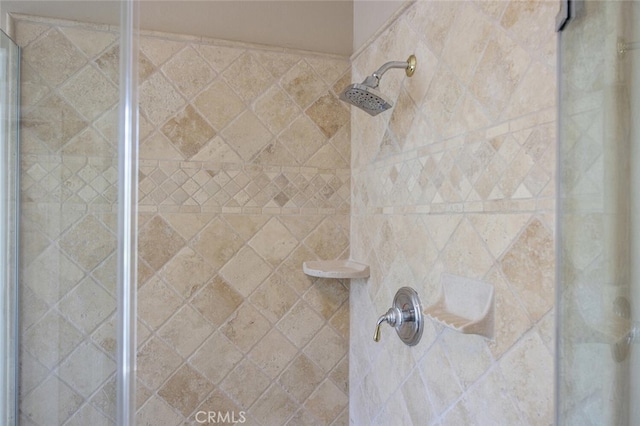 interior details featuring a stall shower
