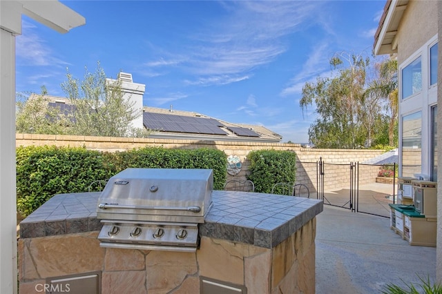 view of patio / terrace featuring a grill, fence, and area for grilling