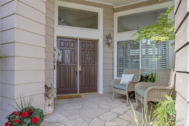 doorway to property featuring covered porch