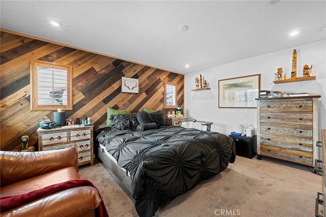 bedroom with recessed lighting and wood walls