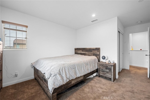 bedroom featuring baseboards, carpet, and visible vents