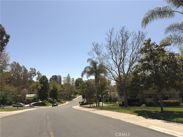 661 Avenida Sevilla Unit O, Laguna Woods, CA 92637 - view of asphalt street featuring sidewalks and curbs