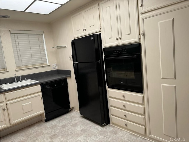 661 Avenida Sevilla Unit O, Laguna Woods, CA 92637 - kitchen with black appliances, dark countertops, and white cabinetry