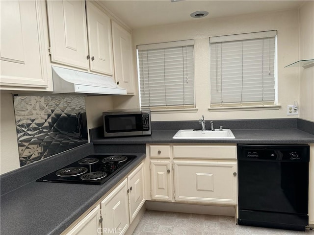 661 Avenida Sevilla Unit O, Laguna Woods, CA 92637 - kitchen with black appliances, under cabinet range hood, dark countertops, backsplash, and white cabinets