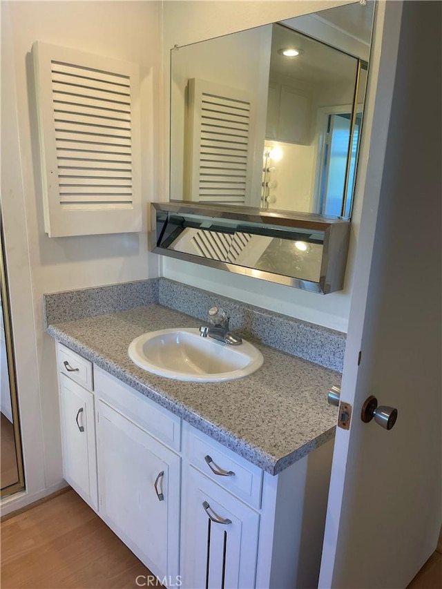 661 Avenida Sevilla Unit O, Laguna Woods, CA 92637 - bathroom featuring vanity and wood finished floors