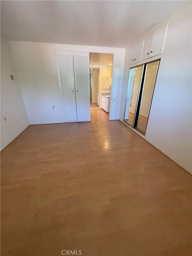 661 Avenida Sevilla Unit O, Laguna Woods, CA 92637 - unfurnished bedroom featuring light wood finished floors