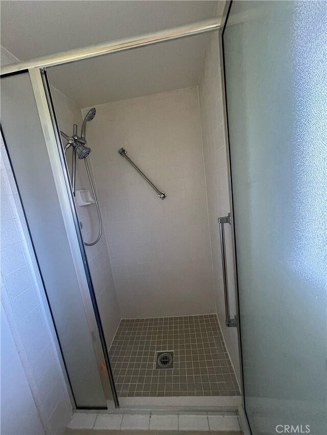 661 Avenida Sevilla Unit O, Laguna Woods, CA 92637 - full bathroom featuring a stall shower and tile patterned floors