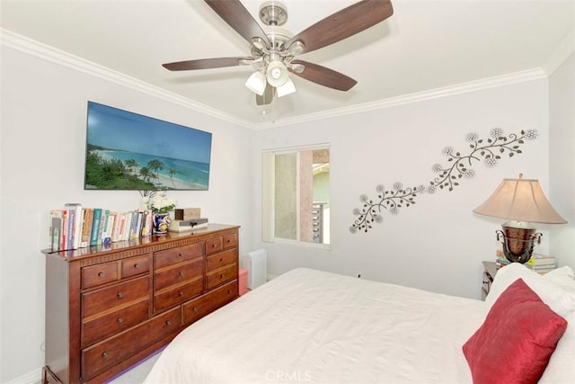 bedroom with a ceiling fan and ornamental molding