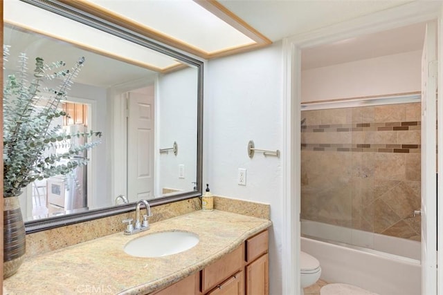 full bathroom with toilet, vanity, and shower / tub combination