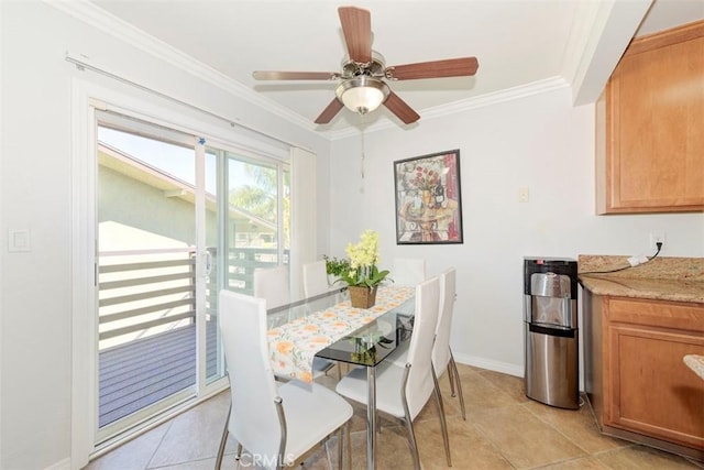 dining area with a ceiling fan, baseboards, crown molding, and light tile patterned floors
