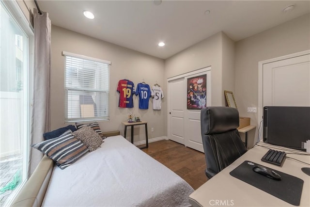 bedroom with baseboards, recessed lighting, and dark wood-type flooring
