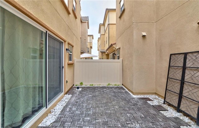 view of patio / terrace featuring fence