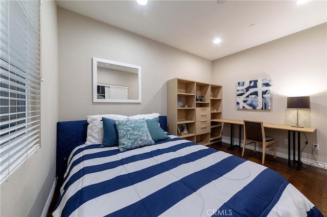 bedroom featuring recessed lighting, wood finished floors, and baseboards