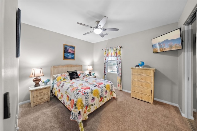 bedroom featuring ceiling fan, baseboards, and carpet