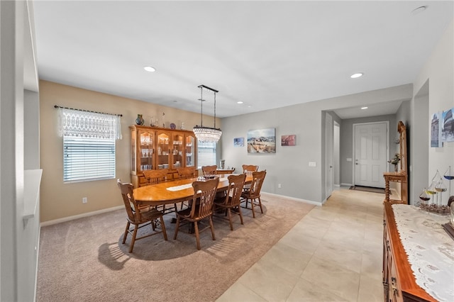 dining space featuring baseboards, light tile patterned flooring, and recessed lighting