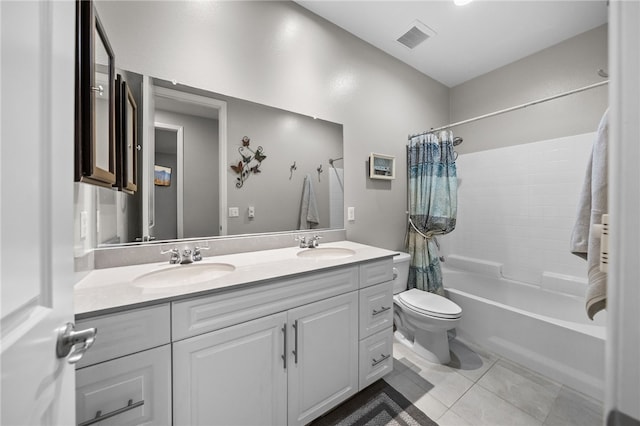 bathroom with visible vents, tile patterned flooring, toilet, and a sink