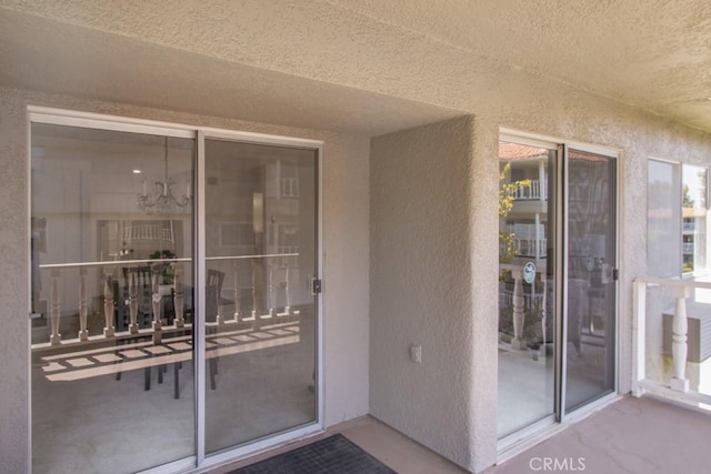 2399 Via Mariposa W Unit 2E, Laguna Woods, CA 92637 - doorway to property featuring stucco siding