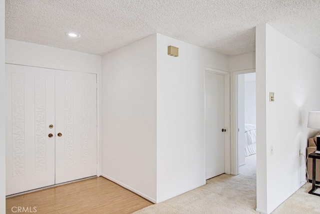 2399 Via Mariposa W Unit 2E, Laguna Woods, CA 92637 - foyer with a textured ceiling and recessed lighting