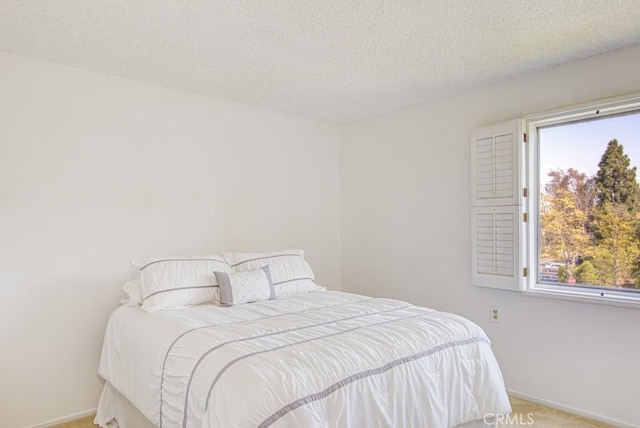 2399 Via Mariposa W Unit 2E, Laguna Woods, CA 92637 - bedroom with carpet floors and a textured ceiling