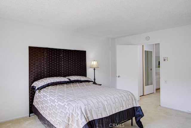 2399 Via Mariposa W Unit 2E, Laguna Woods, CA 92637 - bedroom with light carpet and a textured ceiling