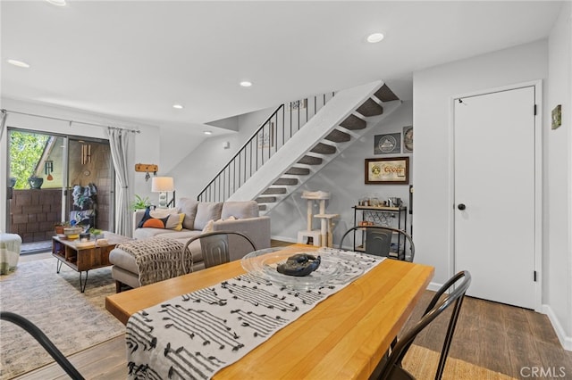 dining room with recessed lighting, stairway, wood finished floors, and baseboards