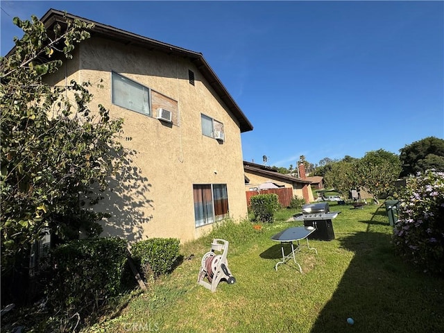 2453 S Ridgewood Dr, West Covina, CA 91792 - view of side of property with stucco siding and a lawn