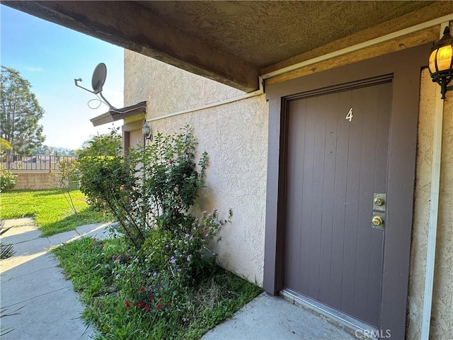 2453 S Ridgewood Dr, West Covina, CA 91792 - doorway to property with stucco siding