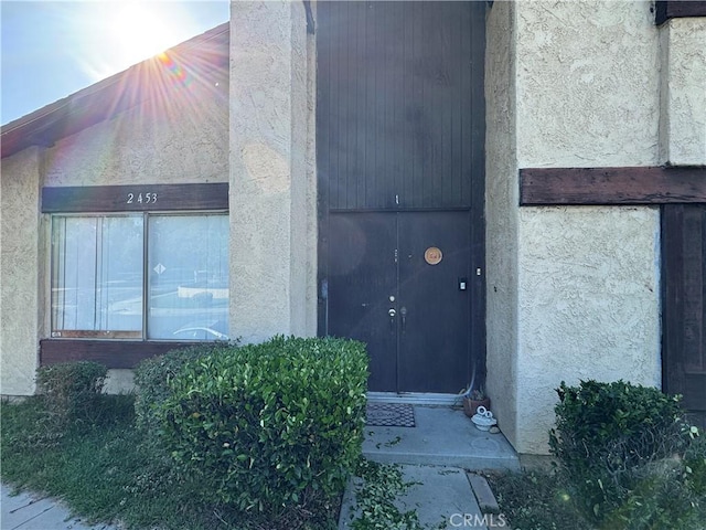 2453 S Ridgewood Dr, West Covina, CA 91792 - view of exterior entry featuring stucco siding