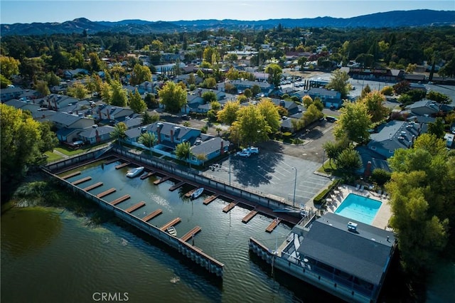 aerial view featuring a water and mountain view