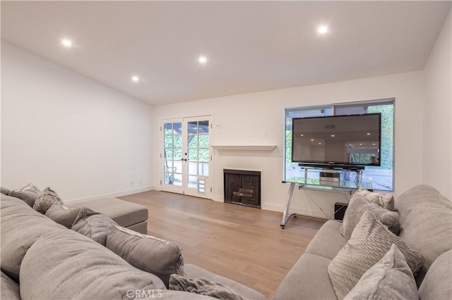 26144 Rainbow Glen Dr, Newhall, CA 91321 - living room with french doors, baseboards, recessed lighting, and wood finished floors