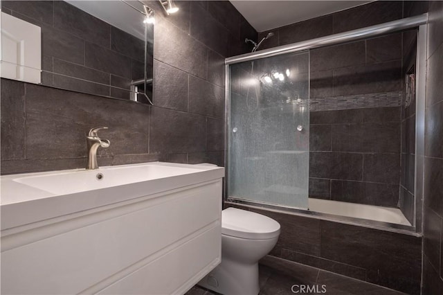 26144 Rainbow Glen Dr, Newhall, CA 91321 - bathroom with toilet, tile patterned flooring, tile walls, and vanity