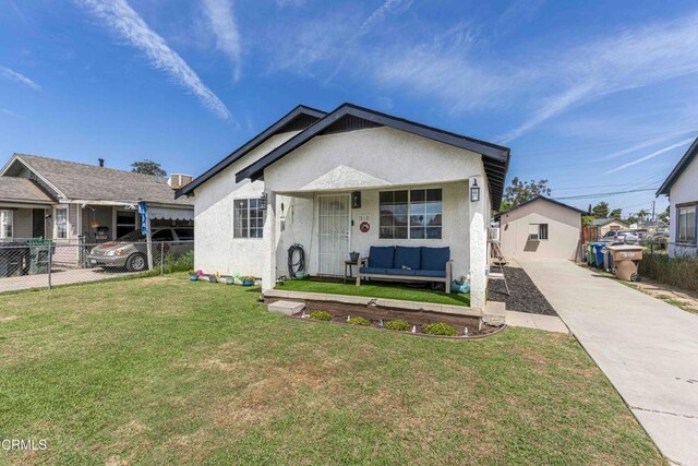 510 Decatur St, Bakersfield, CA 93308 - bungalow-style house with stucco siding, an outdoor living space, driveway, a front yard, and fence