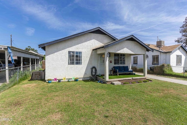510 Decatur St, Bakersfield, CA 93308 - view of front of house featuring fence private yard, stucco siding, a front lawn, and outdoor lounge area