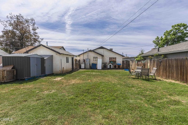 510 Decatur St, Bakersfield, CA 93308 - view of yard with a fenced backyard, an outbuilding, and a storage unit