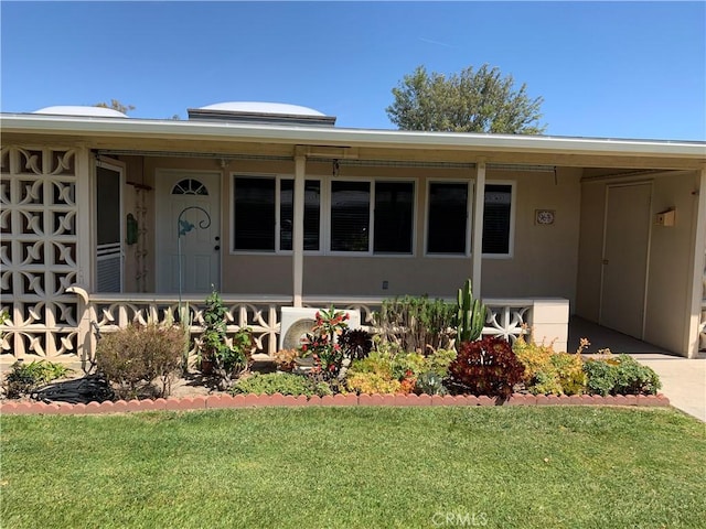 1441 Homewood Rd Unit M5-96B, Seal Beach, CA 90740 - view of front of house featuring a front lawn and stucco siding