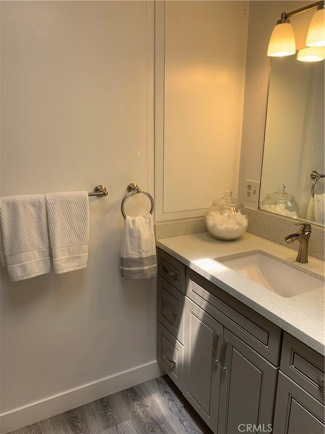 1441 Homewood Rd Unit M5-96B, Seal Beach, CA 90740 - bathroom with vanity, wood finished floors, and baseboards