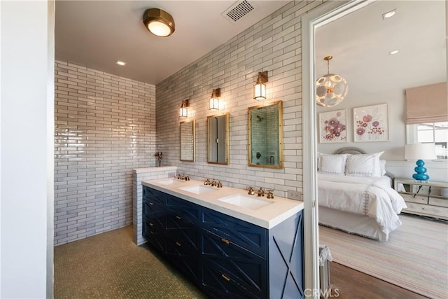 617 Anderson St, Manhattan Beach, CA 90266 - bathroom with a sink, visible vents, tasteful backsplash, and connected bathroom