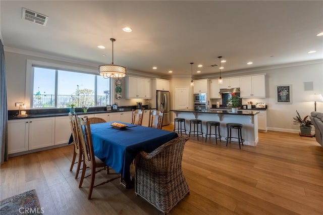 18182 Bissel Dr, Riverside, CA 92508 - dining space with crown molding, light wood-style flooring, recessed lighting, and baseboards