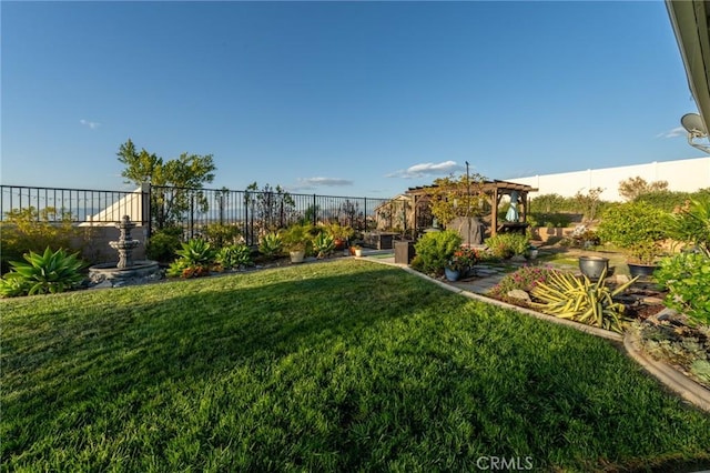 view of yard with fence and a gazebo