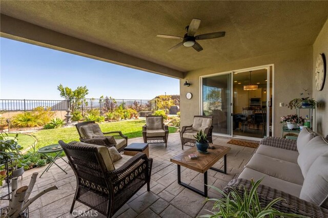 view of patio / terrace with a fenced backyard, ceiling fan, and an outdoor hangout area