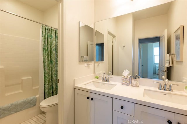 bathroom with shower / tub combo, a sink, double vanity, and toilet