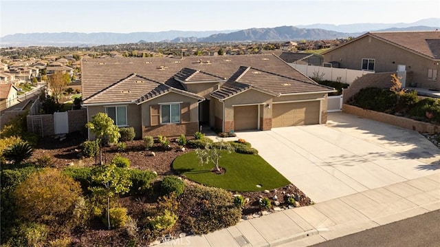 18182 Bissel Dr, Riverside, CA 92508 - ranch-style home with a garage, fence, driveway, stucco siding, and a tile roof