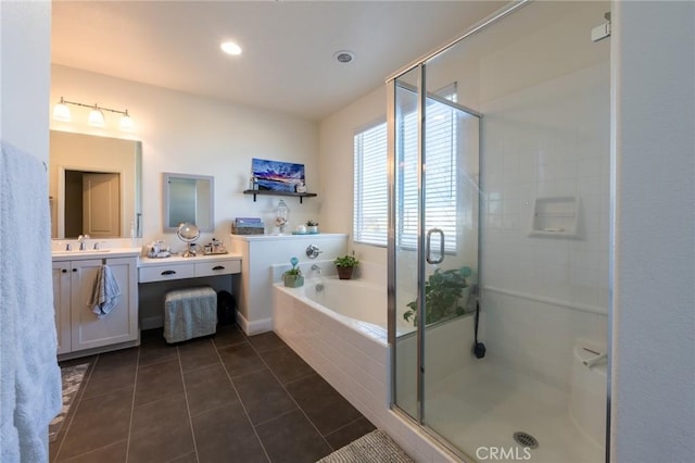 bathroom with a garden tub, vanity, tile patterned flooring, and a shower stall