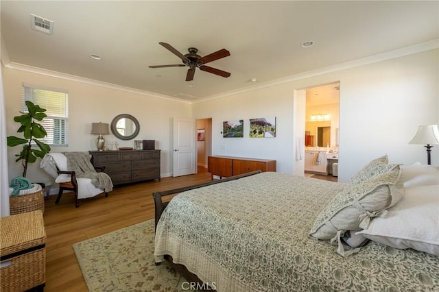 bedroom with ceiling fan, ornamental molding, wood finished floors, and visible vents