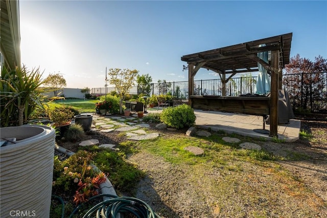 view of yard with fence and a pergola