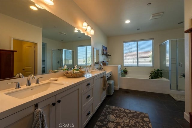full bath with a garden tub, a sink, a shower stall, and double vanity