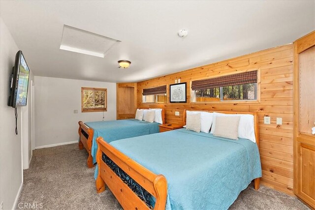 105 Olympic Dr, Big Bear Lake, CA 92315 - bedroom with wood walls, carpet, multiple windows, and attic access