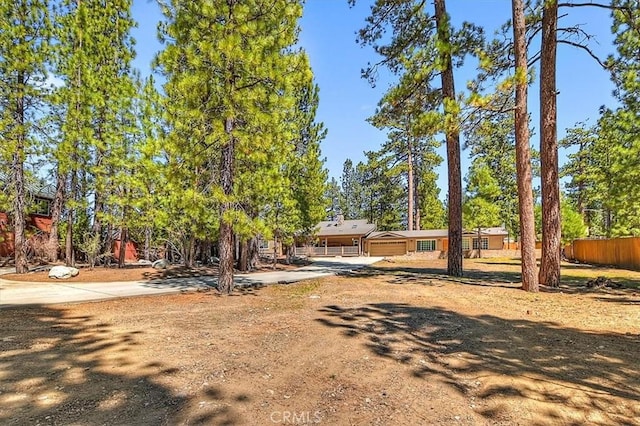 105 Olympic Dr, Big Bear Lake, CA 92315 - view of front of property with fence and driveway