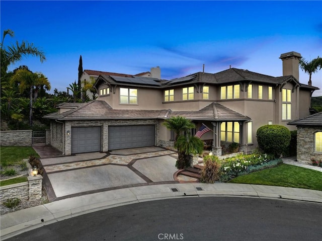 2 Aquila Way, Coto De Caza, CA 92679 - view of front of house with asphalt driveway, stucco siding, a chimney, and roof mounted solar panels
