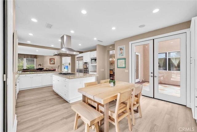 2 Aquila Way, Coto De Caza, CA 92679 - dining area with french doors, light wood-style floors, and recessed lighting